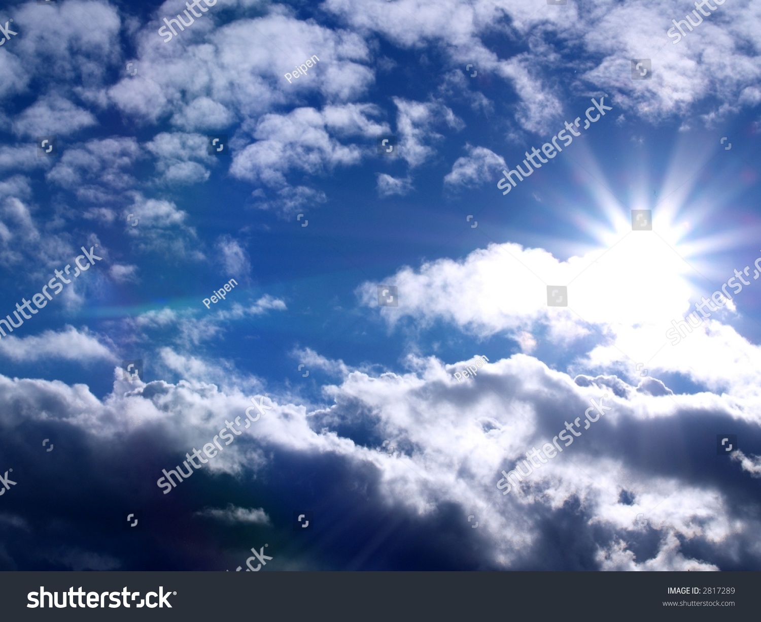 Bright Shining Sun On A Blue Sky With Some Clouds Stock Photo 2817289 ...