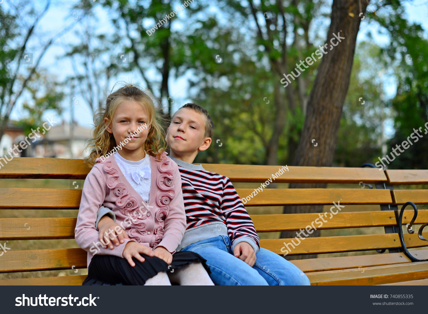 Brother Sister Cuddling Sitting On Bench Stock Photo 740855335 