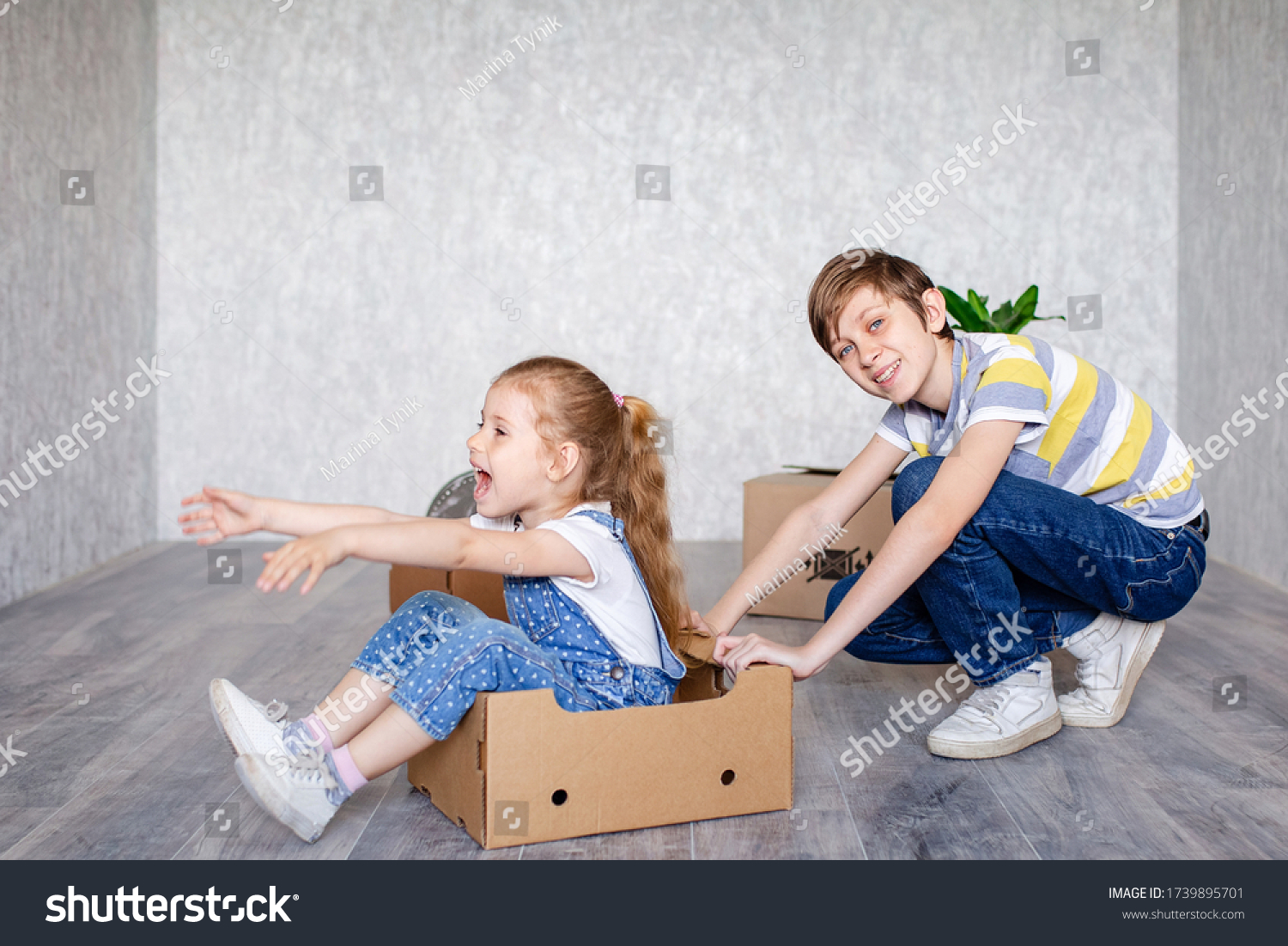 Brother Rides Sister Cardboard Box Children Stock Photo (Edit Now