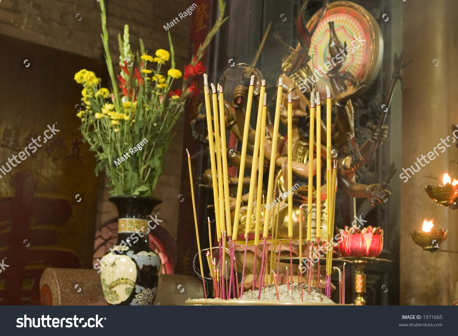 Buddhist Altar In A Temple In Vietnam With Incense, Flowers, And Other ...