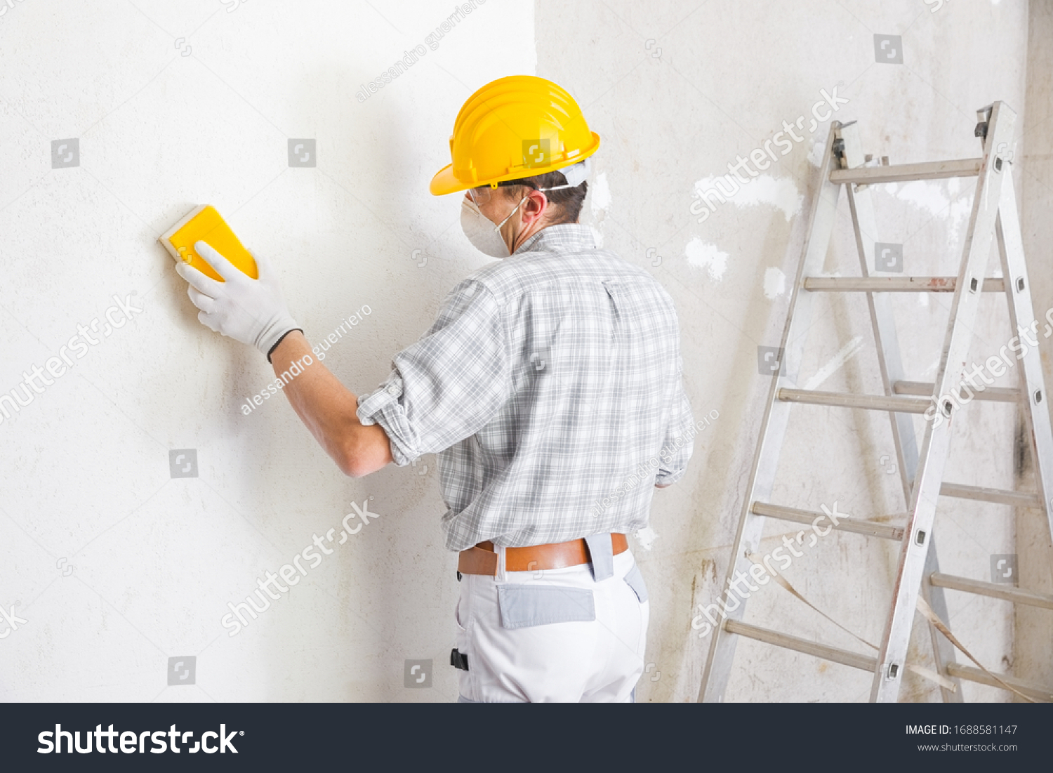 23 957 Painting The Mask Stock Photos Images Photography Shutterstock   Stock Photo Builder Sanding And Smoothing A Newly Plastered White Interior Wall In A House Getting It Ready For 1688581147 