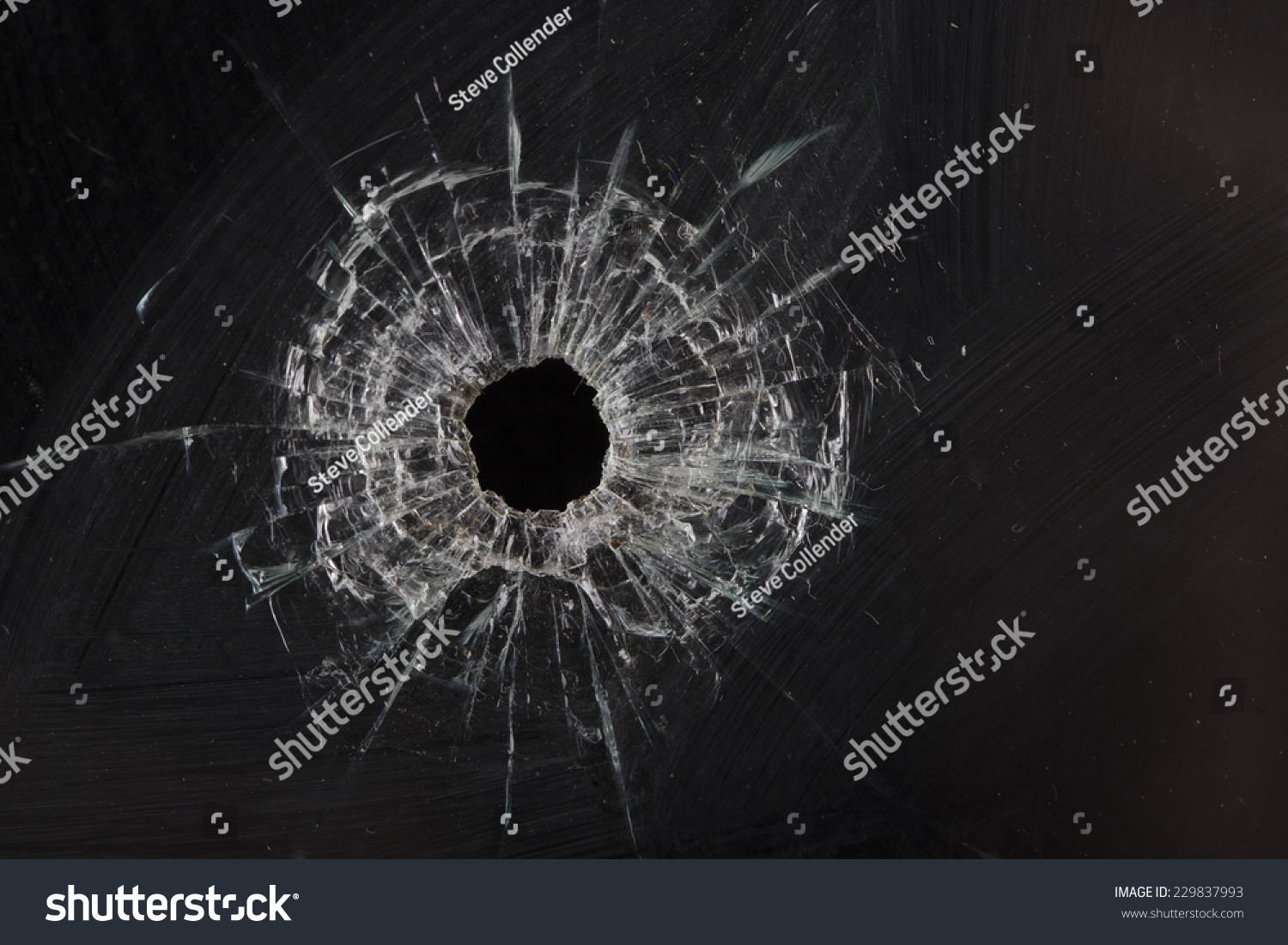 Bullet Holes In Glass Isolated On Black Stock Photo 229837993 ...