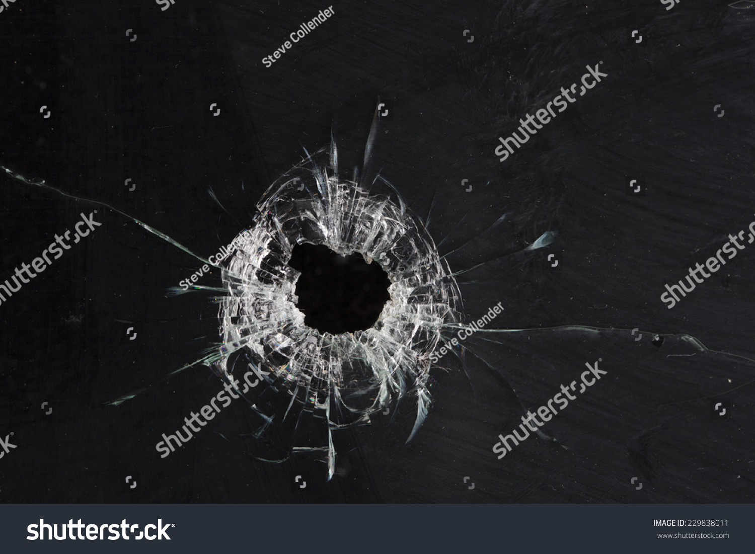 Bullet Holes In Glass Isolated On Black Stock Photo 229838011 ...