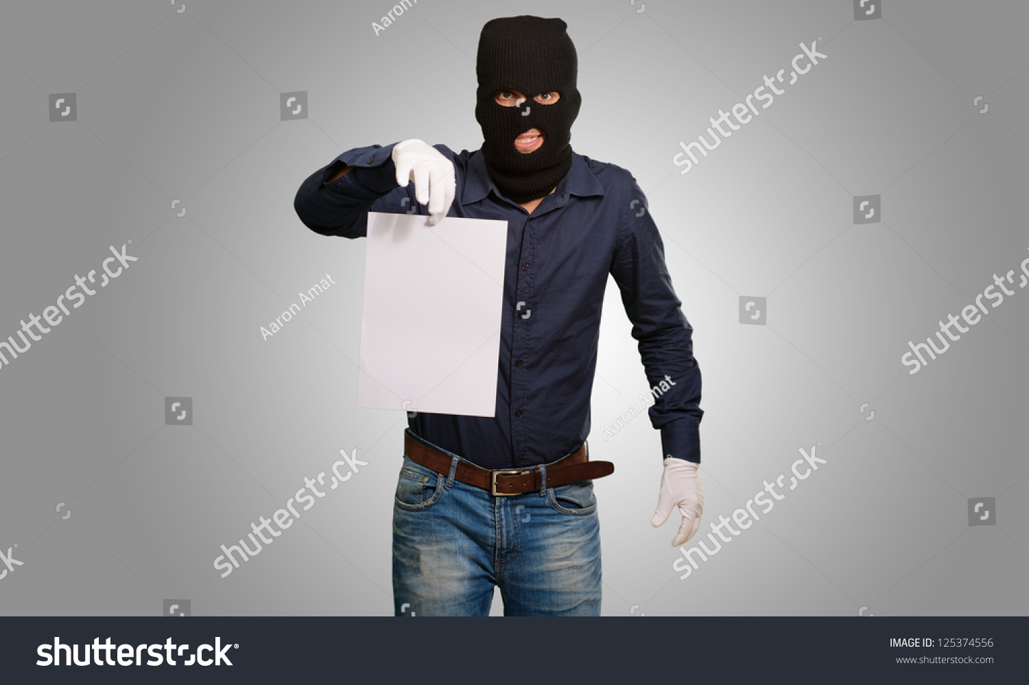 Burglar In Face Mask On Gray Background Stock Photo 125374556 ...