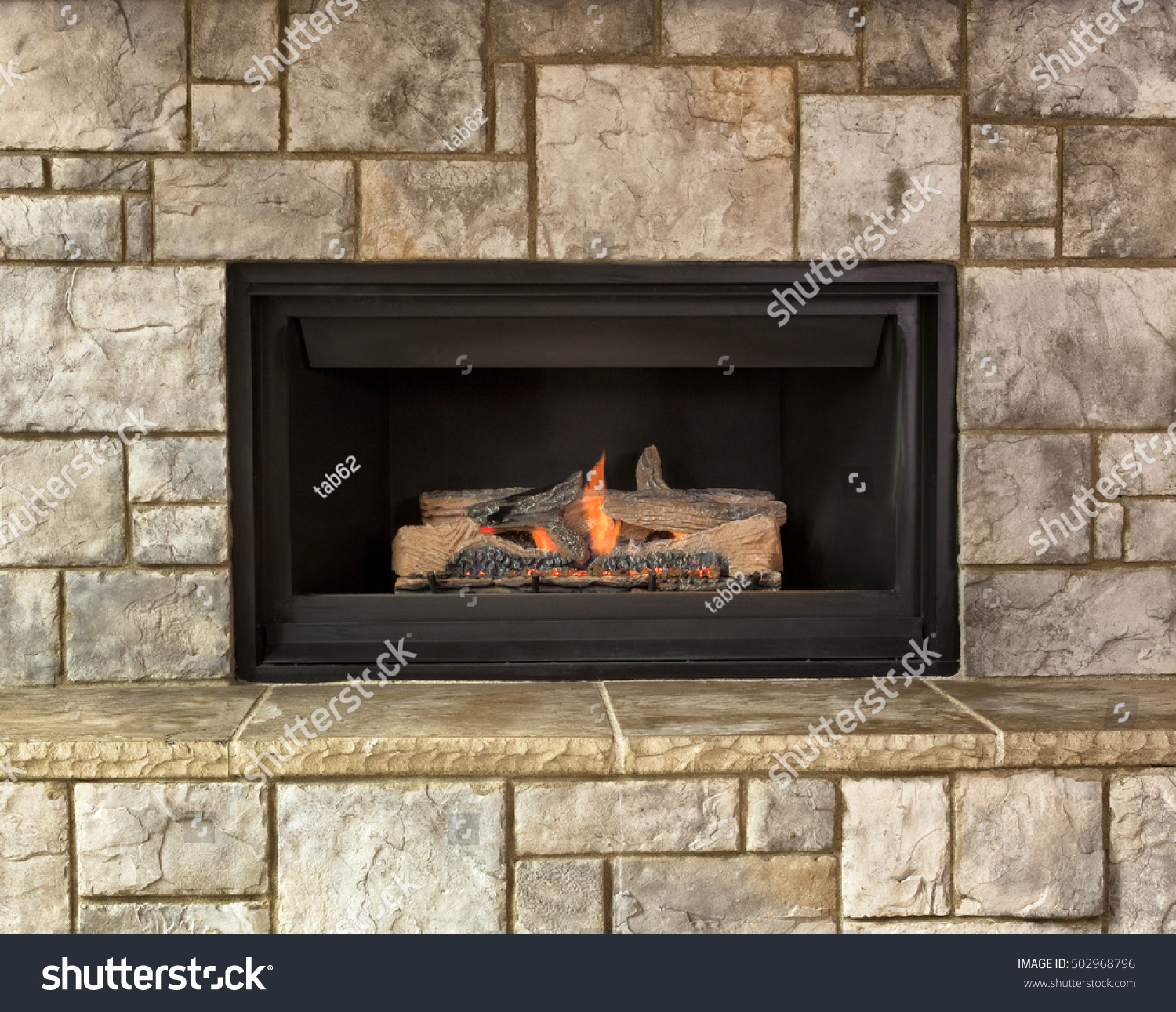 Burning Natural Gas Fireplace Surround By Stock Photo Edit Now