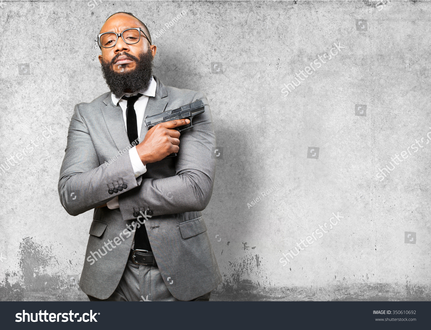 Business Black Man Holding A Gun Stock Photo 350610692 : Shutterstock