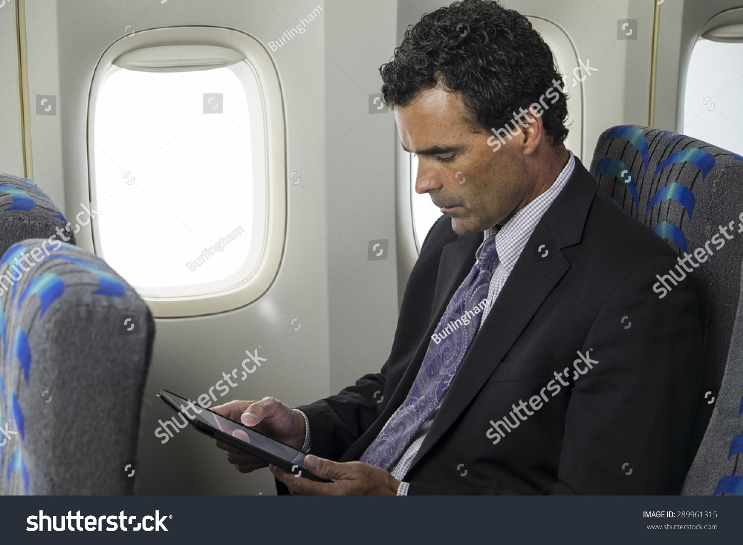 Business Man On Plane Using Ipadtablet Stock Photo 289961315 - Shutterstock