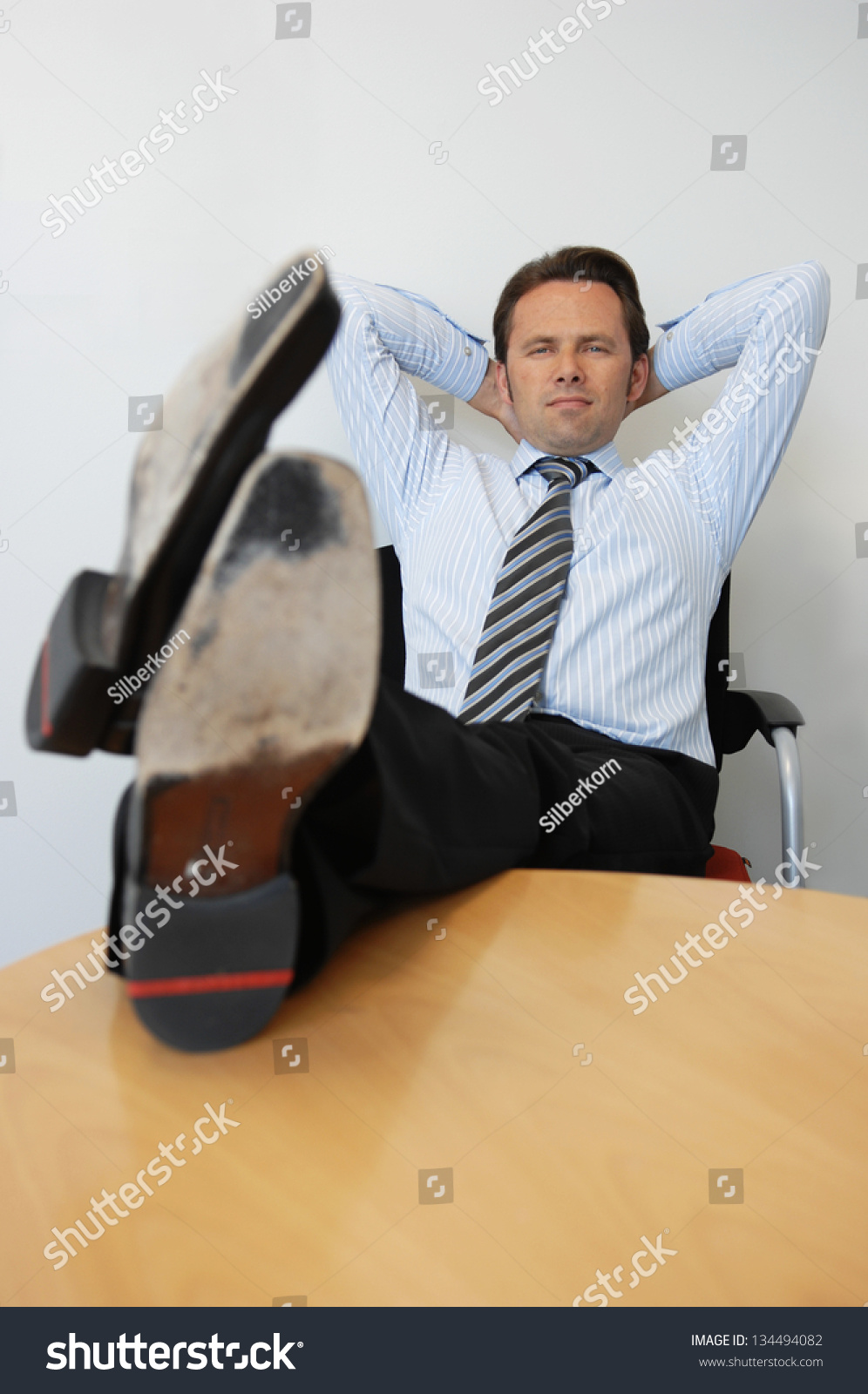 Business Man With Feet On The Table Stock Photo 134494082 : Shutterstock