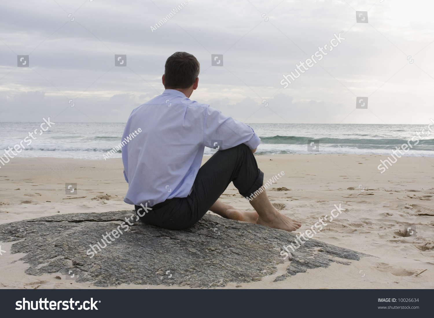 Businessman Contemplating Sea While Sitting Barefoot Stock Photo (Edit ...