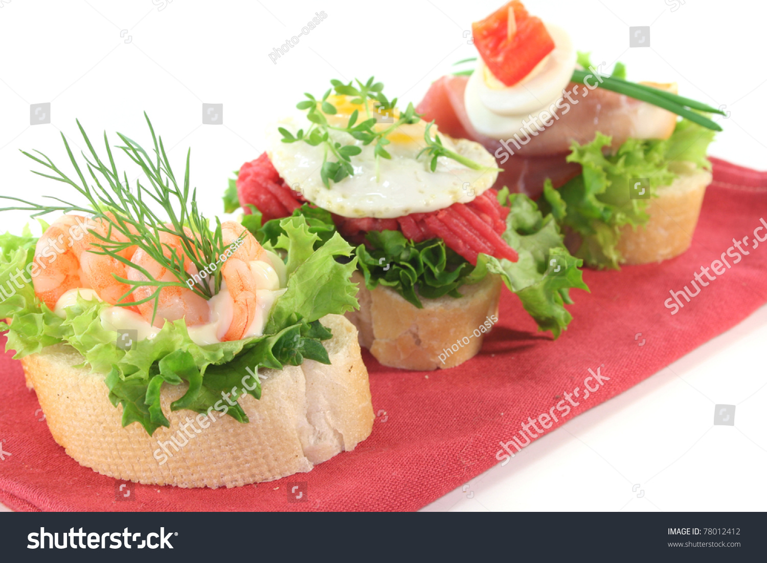 Canape With Lettuce, Ham, Steak Tartare, Shrimp And Quail Eggs On A ...