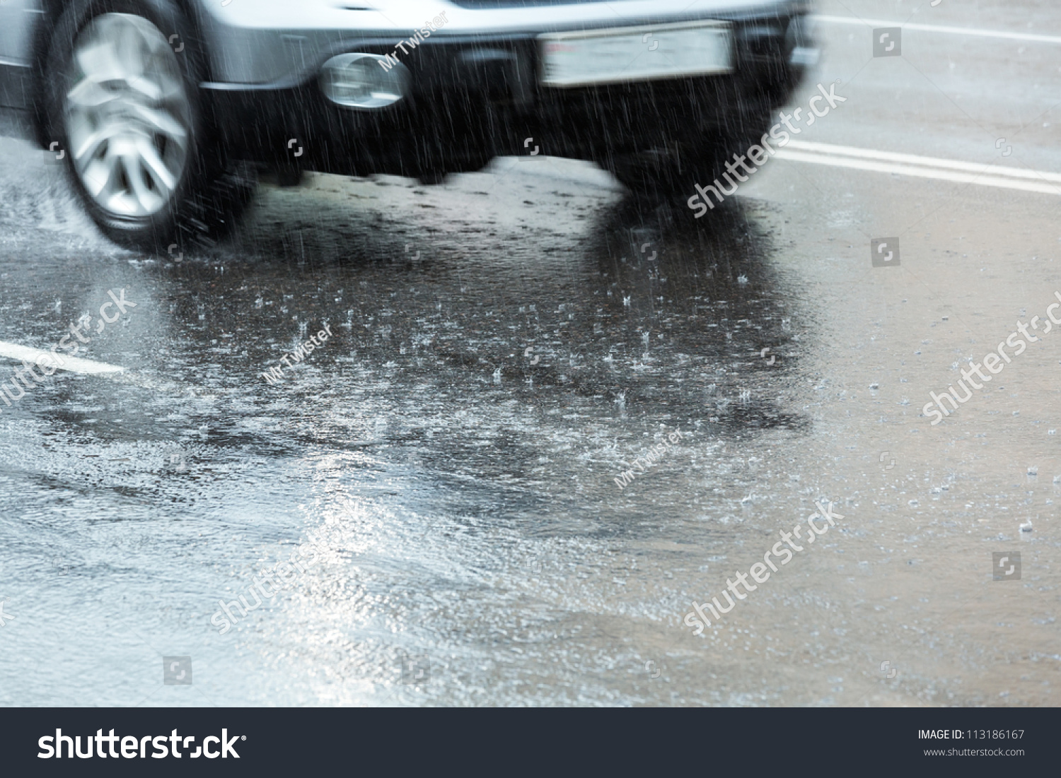 Car Driving Through A Large Puddle In A Downpour Stock Photo 113186167 ...