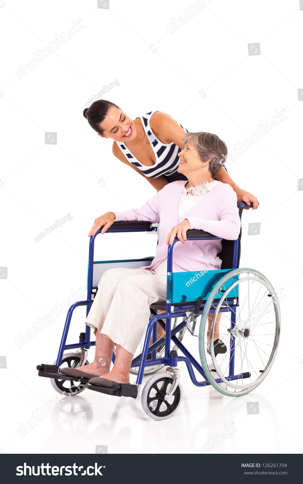 Caring Daughter Talking To Disabled Senior Mother Isolated On White ...