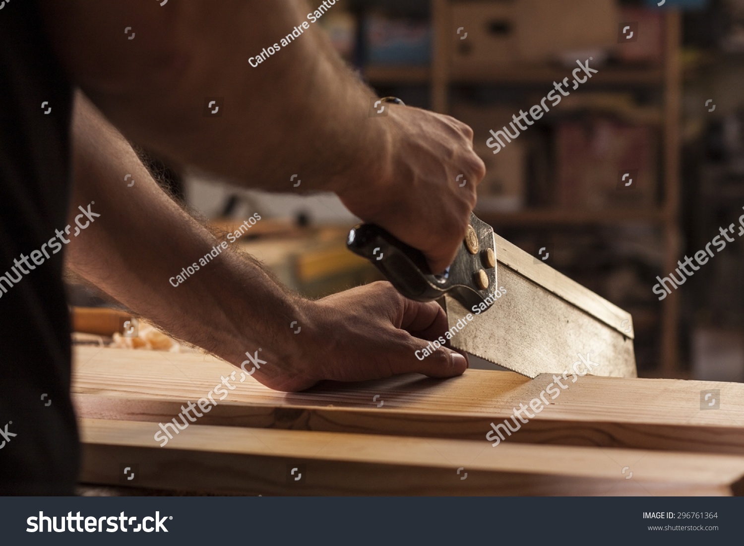 Carpenter Cutting Planks With Wood Saw Stock Photo 296761364 : Shutterstock