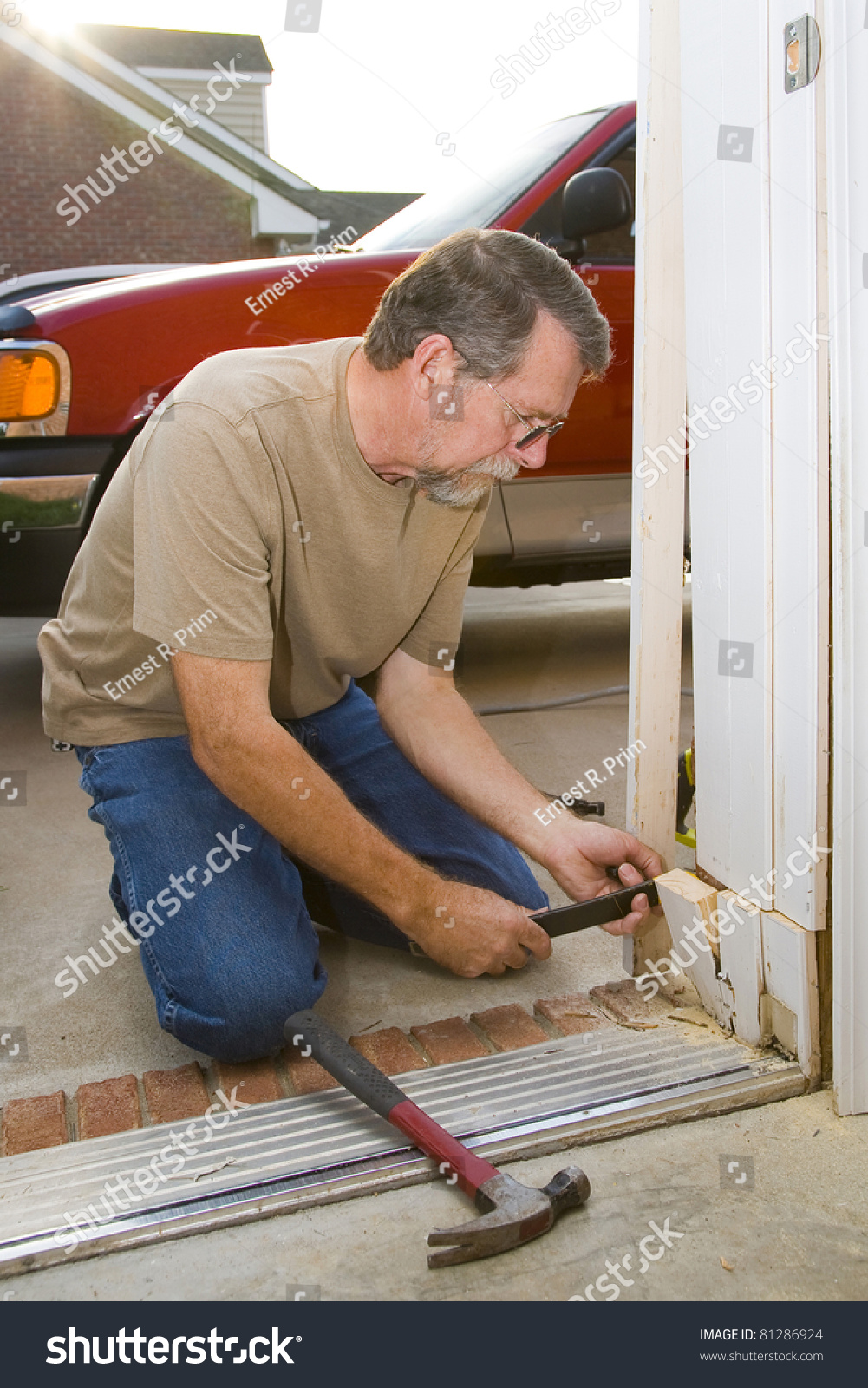 Carpenter Repairing Exterior Door Casing Weather Stock Photo