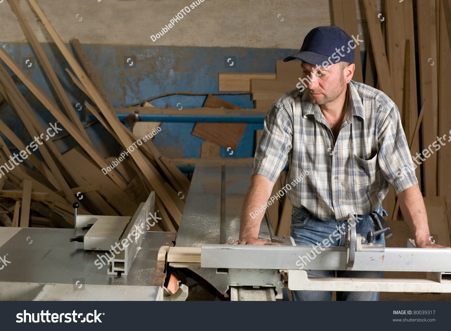 Carpenter Working On Woodworking Machines In Carpentry Shop. Stock ...