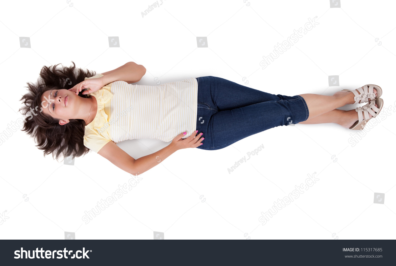 Casual Attractive Young Woman Lying On Her Back On The Floor With Her ...