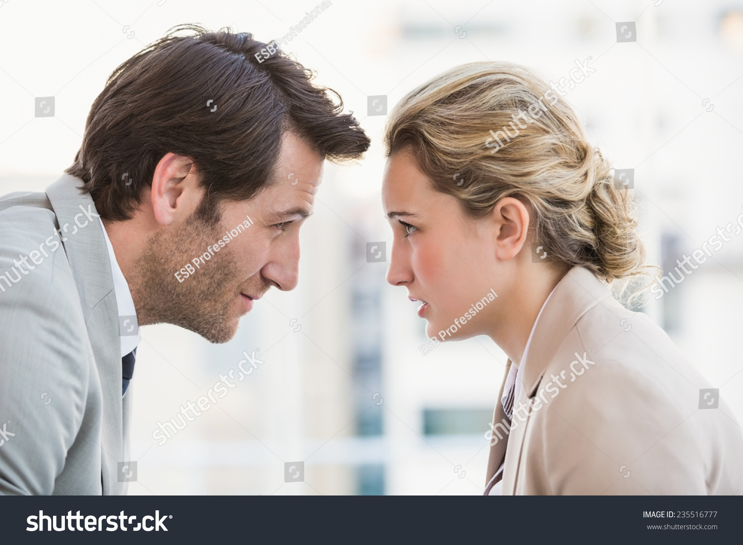 http://image.shutterstock.com/z/stock-photo-casual-business-colleagues-in-argument-at-work-235516777.jpg