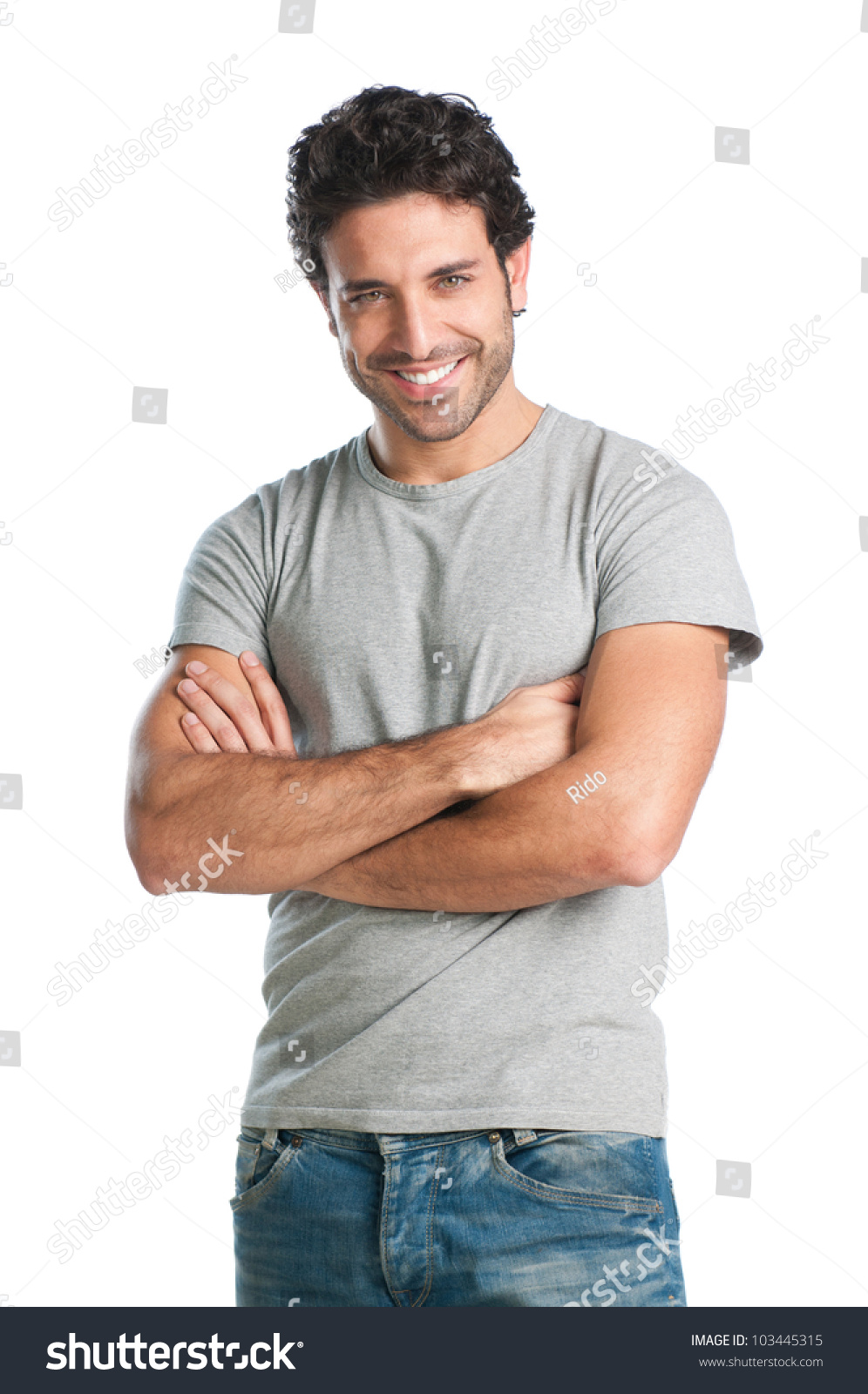 Casual Young Man Looking At Camera With Arms Crossed And Satisfaction ...
