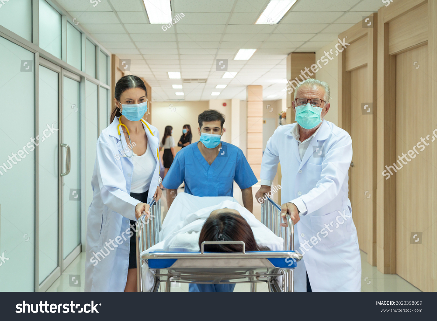 Caucasian Doctor Asian Male Nurse Moving Stock Photo (Edit Now) 2023398059