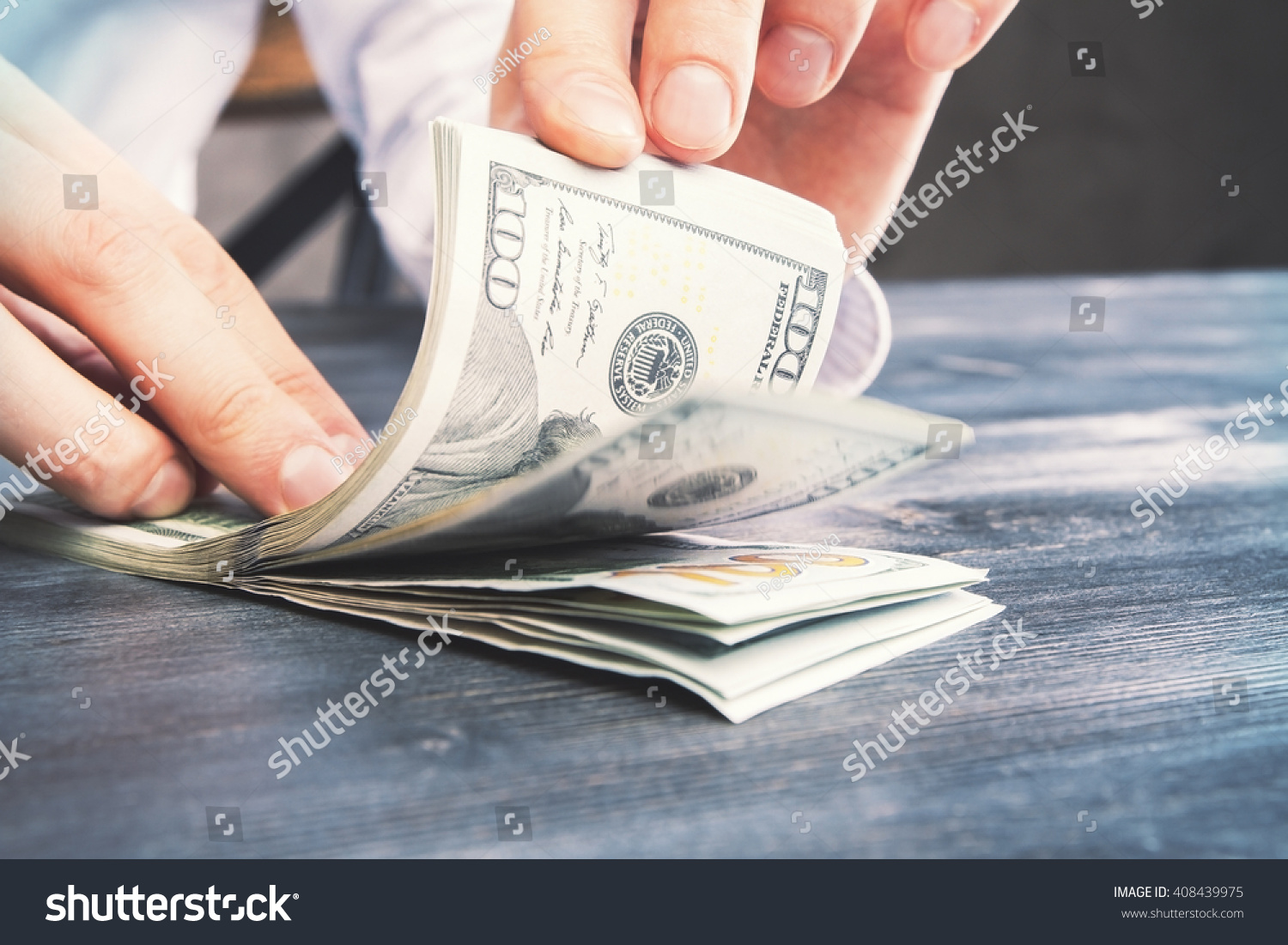 worksheet Counting Dollar Bills caucasian hands counting dollar bills on stock photo 408439975 darw wooden table