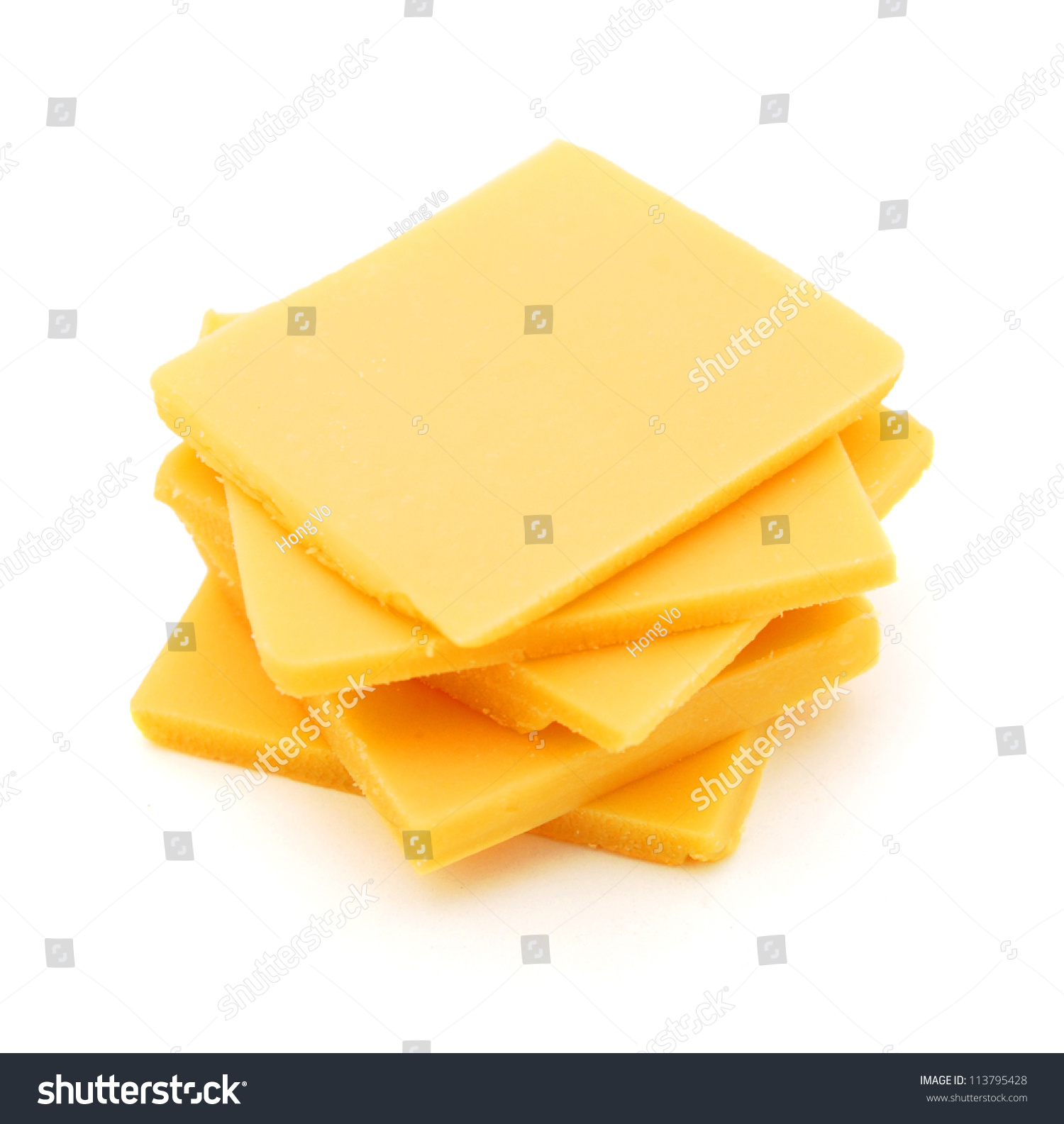 Cheddar Cheese Slices On White Background. Stock Photo 113795428 ...