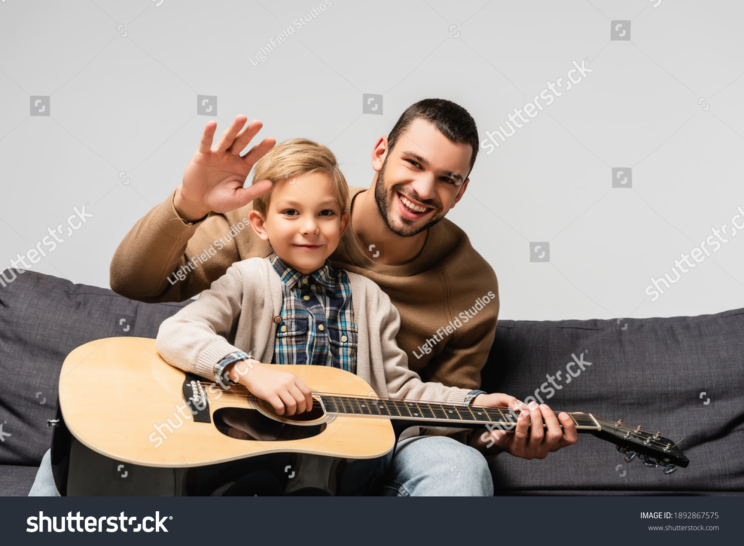 Cheerful Boy Playing Acoustic Guitar Near Stock Photo