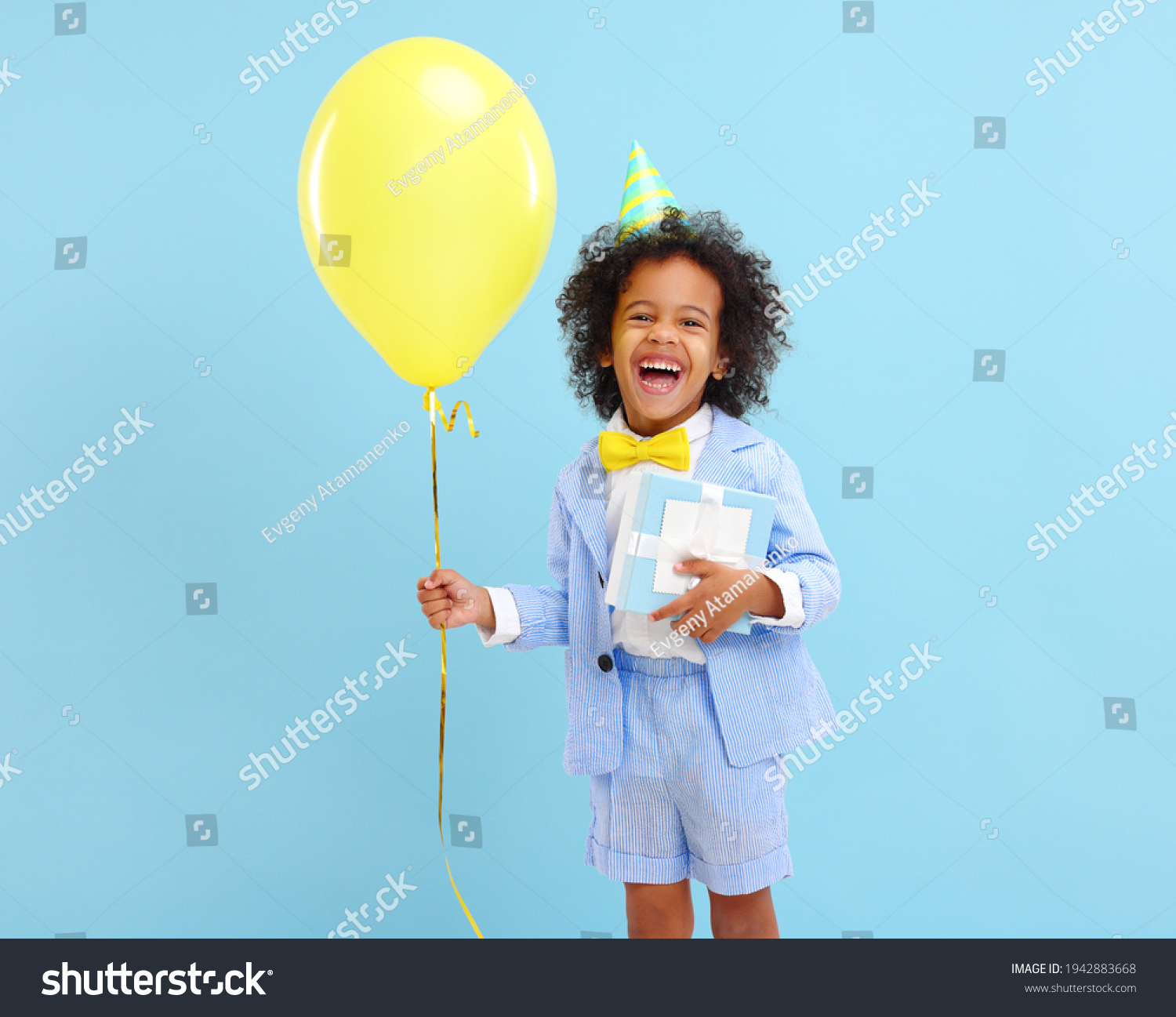 cheerful-little-black-boy-curly-hair-1942883668-shutterstock