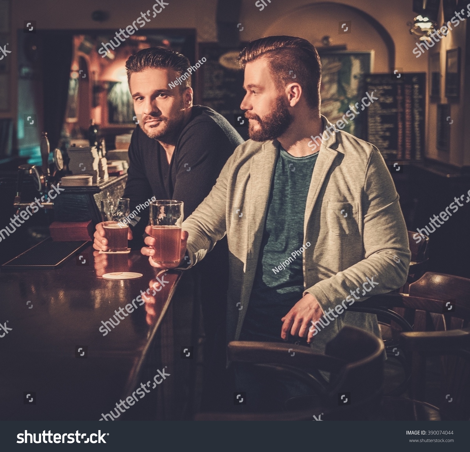 Cheerful Old Friends Drinking Draft Beer Stock Photo