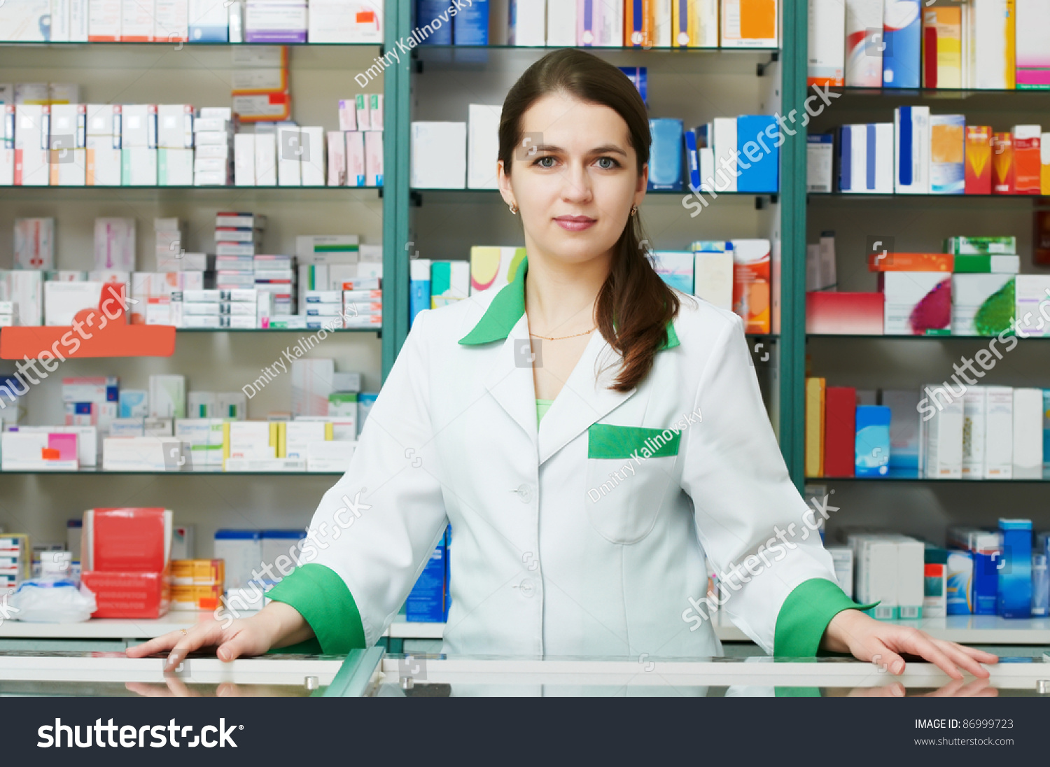 http://image.shutterstock.com/z/stock-photo-cheerful-pharmacist-chemist-woman-standing-in-pharmacy-drugstore-86999723.jpg
