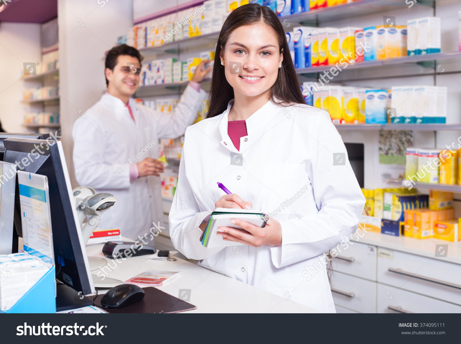 stock-photo-cheerful-pharmacist-standing