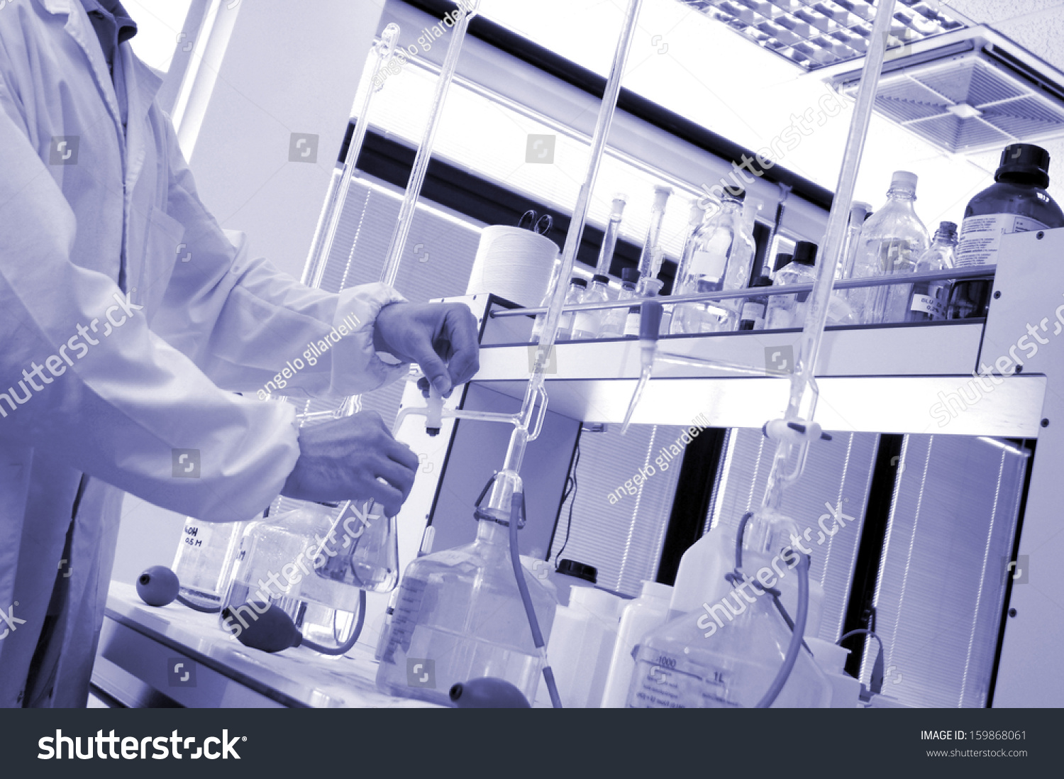 chemical-laboratory-technician-making-a-test-stock-photo-159868061-shutterstock