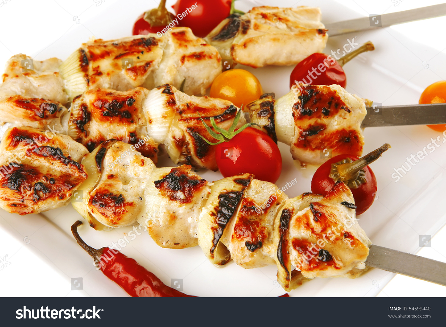 Chicken Shish Kebab On White Platter With Vegetables Stock Photo ...