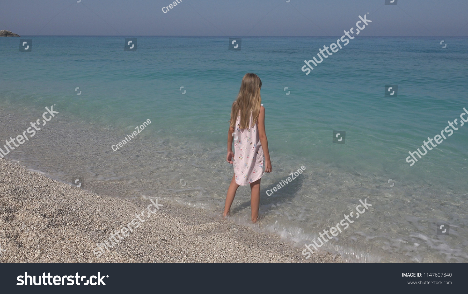 Child Playing On Beach Girl Looking Stock Photo 1147607840 | Shutterstock