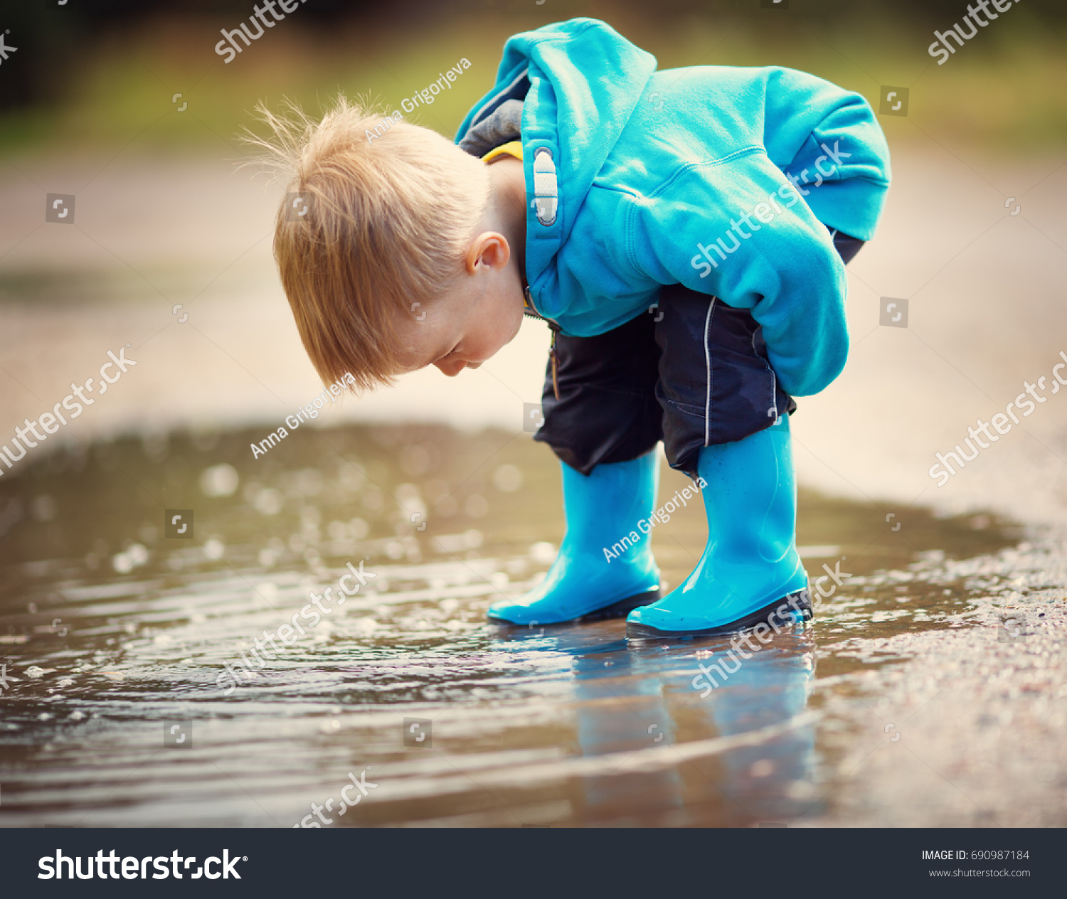 Child Walking Wellies Puddle On Rainy Stock Photo 690987184 Shutterstock