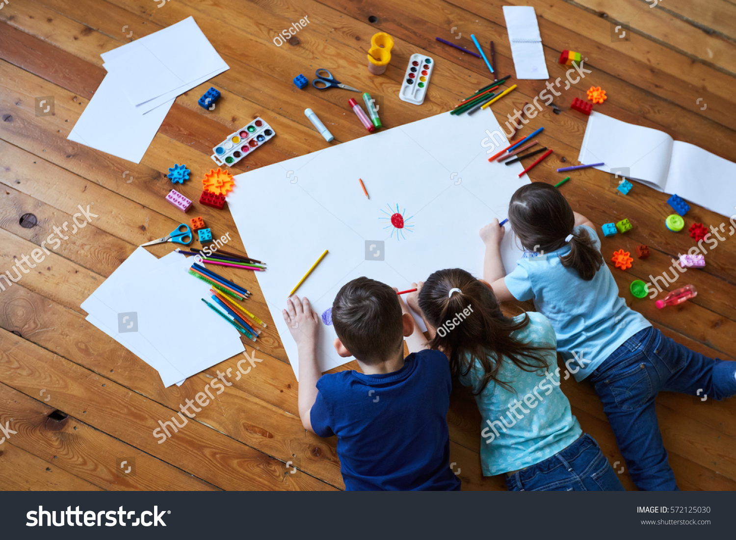 Children Draw Together On Large Sheet Stock Photo (Edit Now) 572125030
