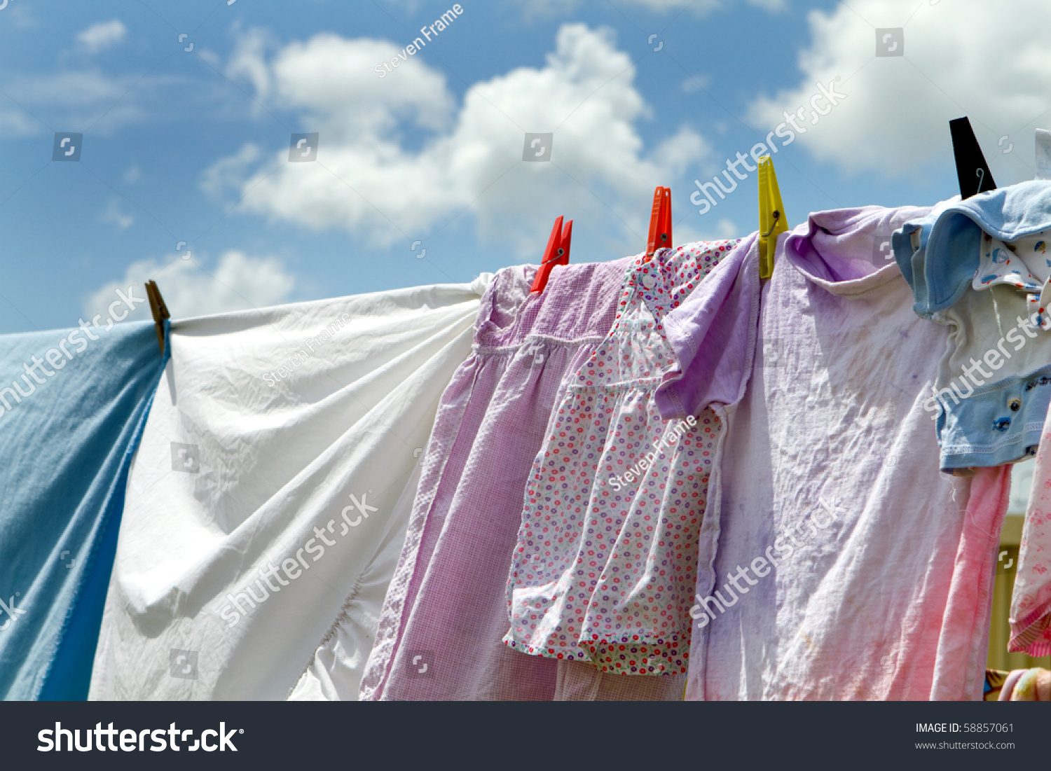 Children'S Clothes And Bedsheets Have Been Hung Out To Dry On A ...