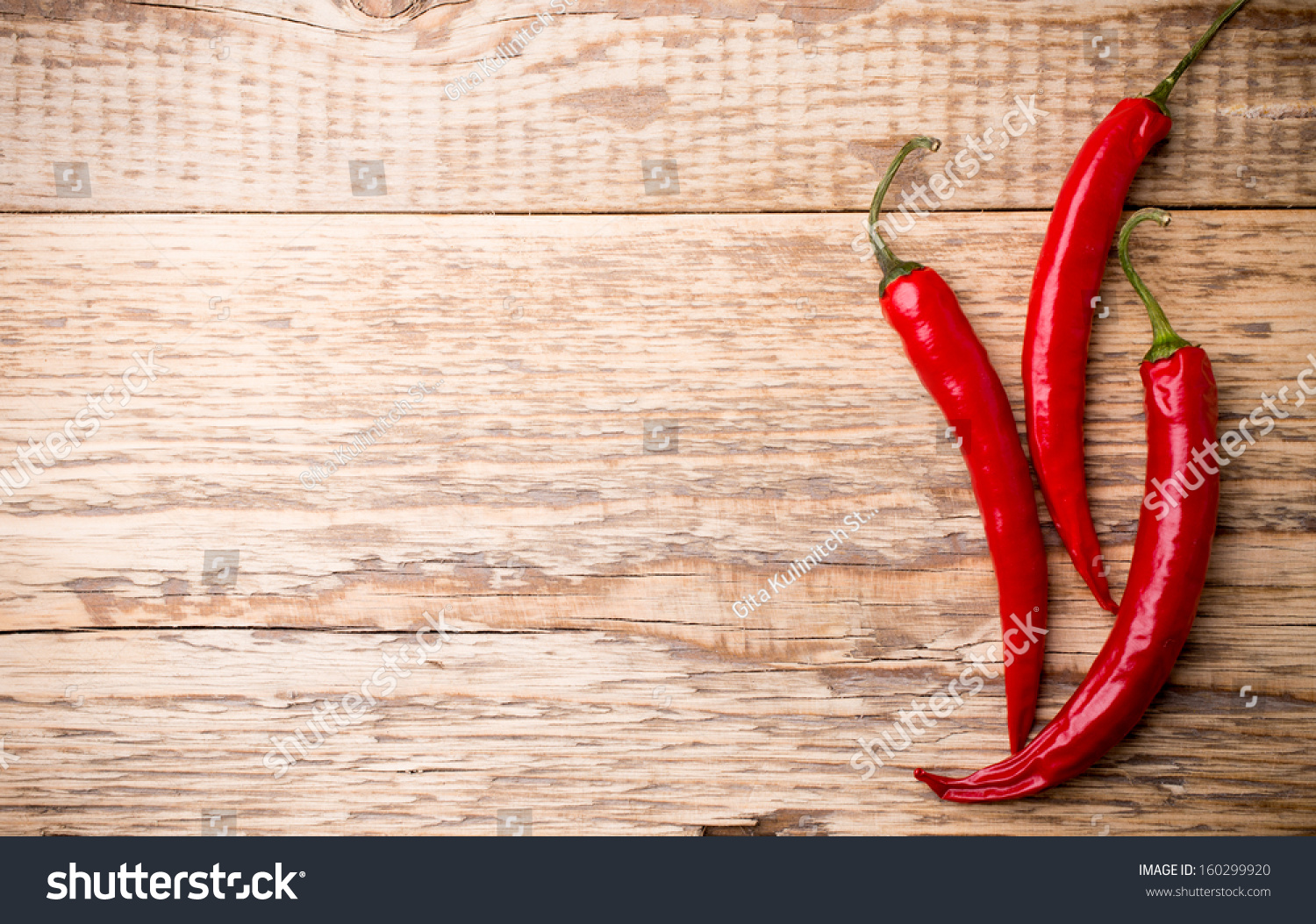 Chili Pepper On The Wooden Background. Stock Photo 160299920 : Shutterstock