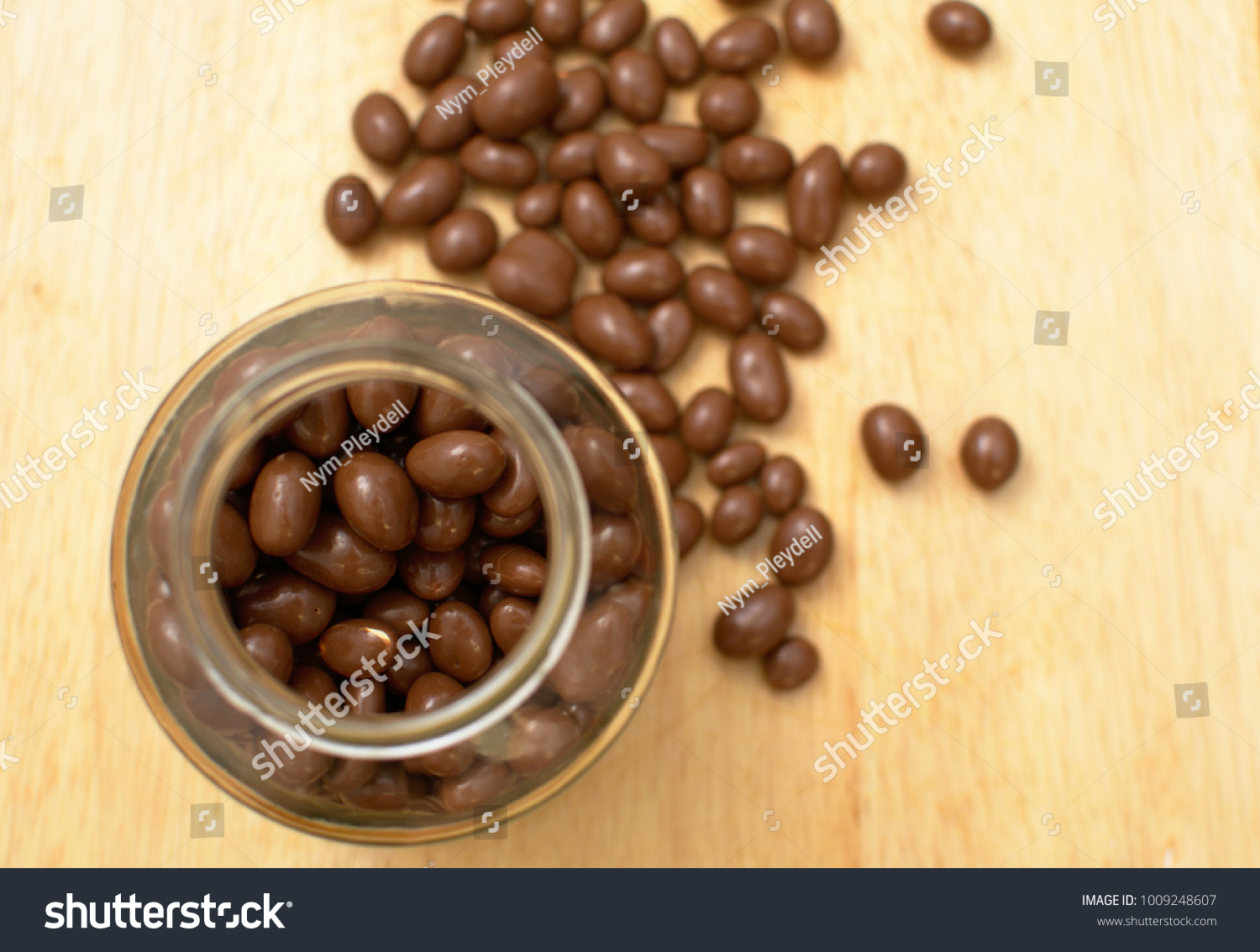 Download Chocolate Peanuts Coated Clear Glass Jar Stock Photo Edit Now 1009248607 Yellowimages Mockups