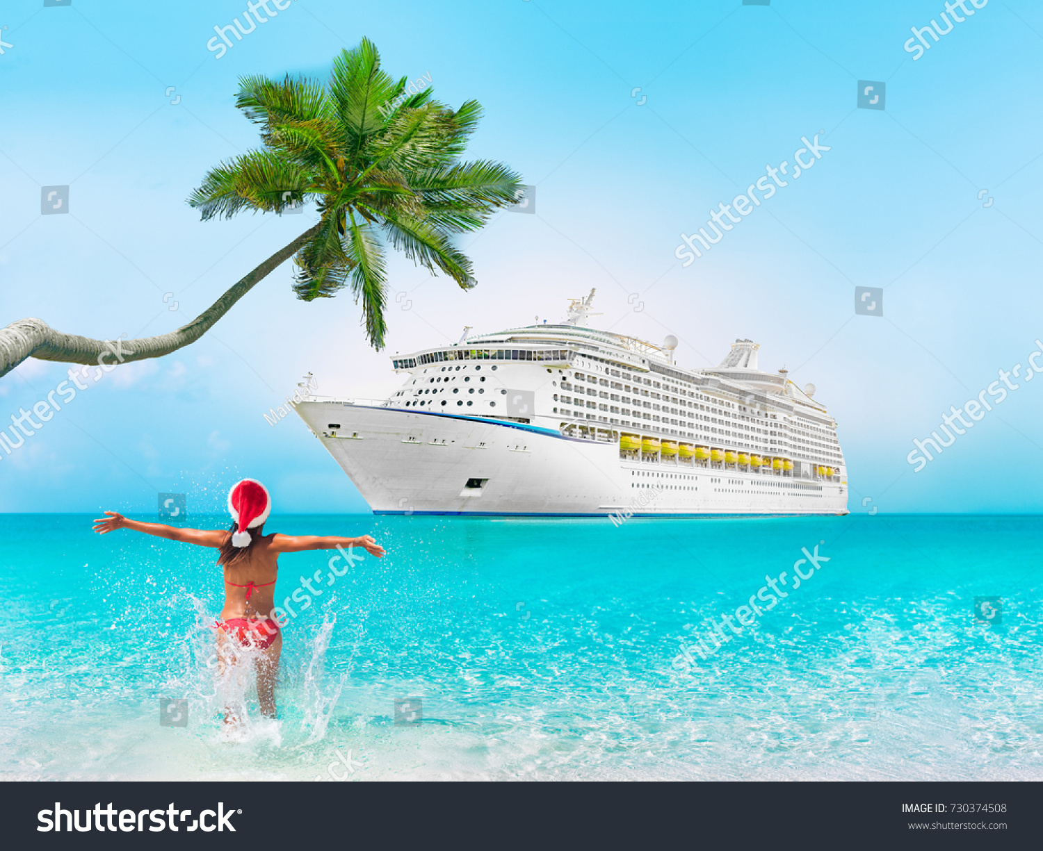 Christmas cruise travel vacation woman swimming at Caribbean beach with ship and palm tree in background
