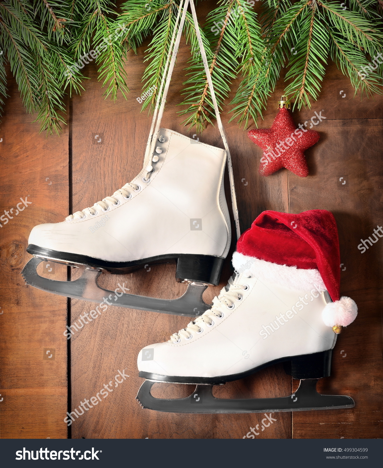 christmas decoration white ice skates for figure skating hanging on a wooden background - Ice Skate Christmas Decoration christmas decoration white ice skates for figure skating hanging on a wooden background - Ice Skate Christmas Decoration