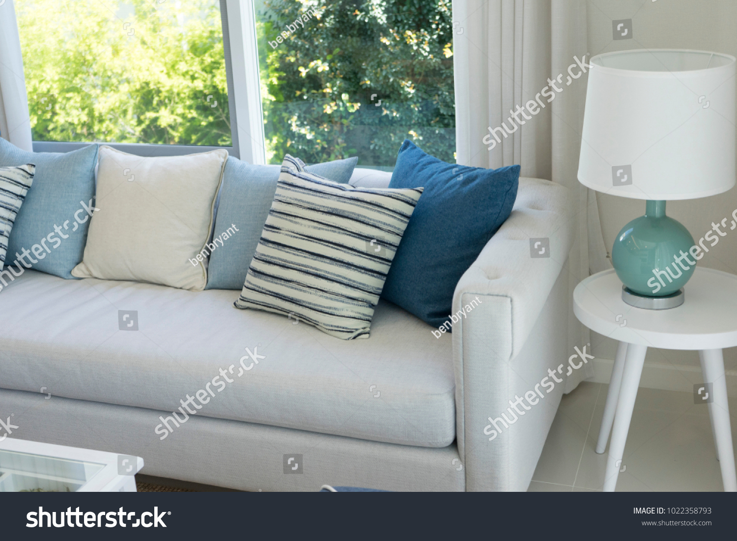 gray sofa blue pillows