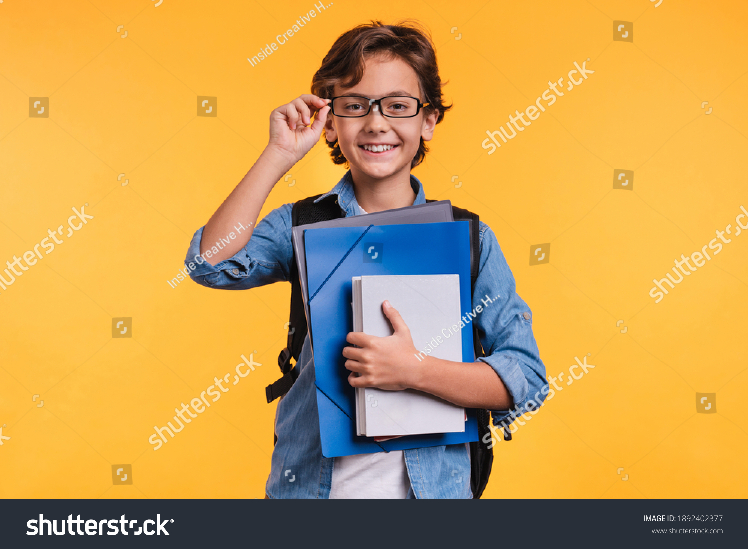 Clever Young Boy Holding Folders Studing Stock Photo 1892402377 ...