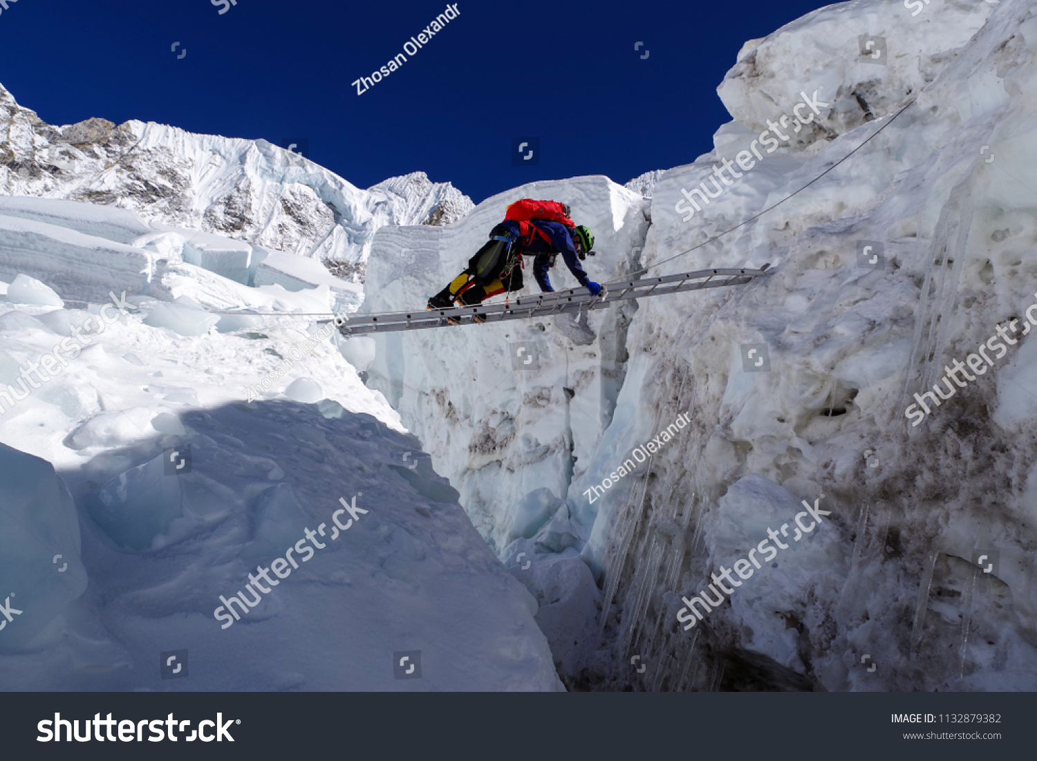 Climber Passes Crack Glacier On Ladder Stock Photo (Edit Now.