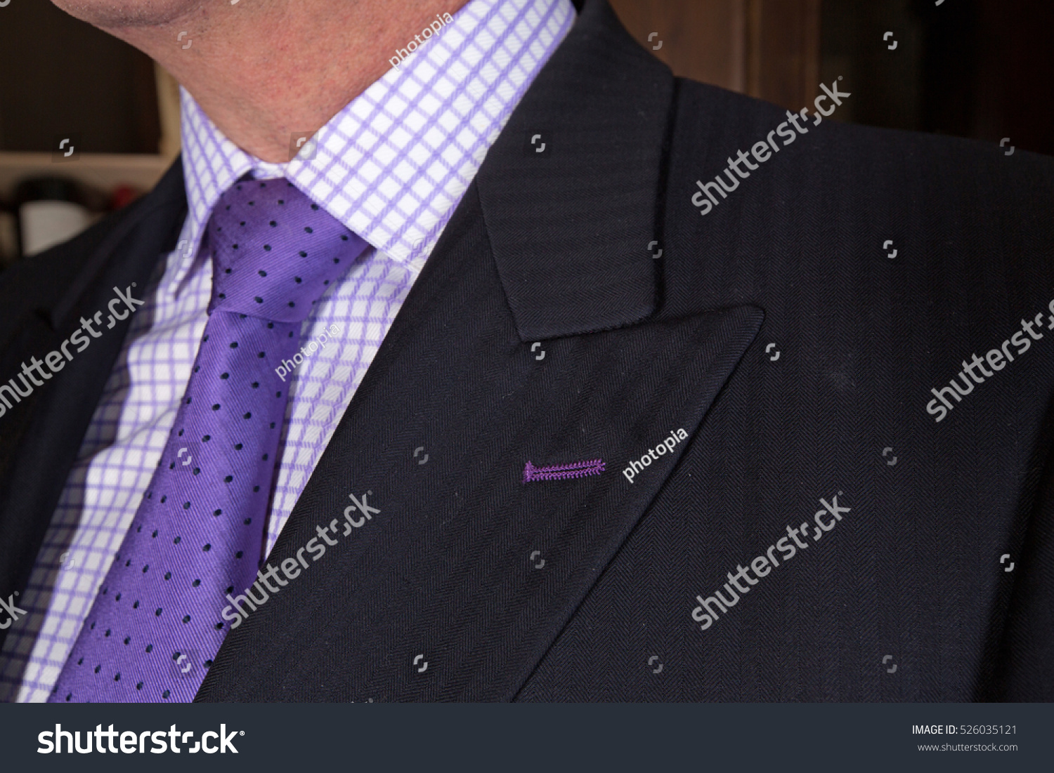 dark grey suit with lavender shirt