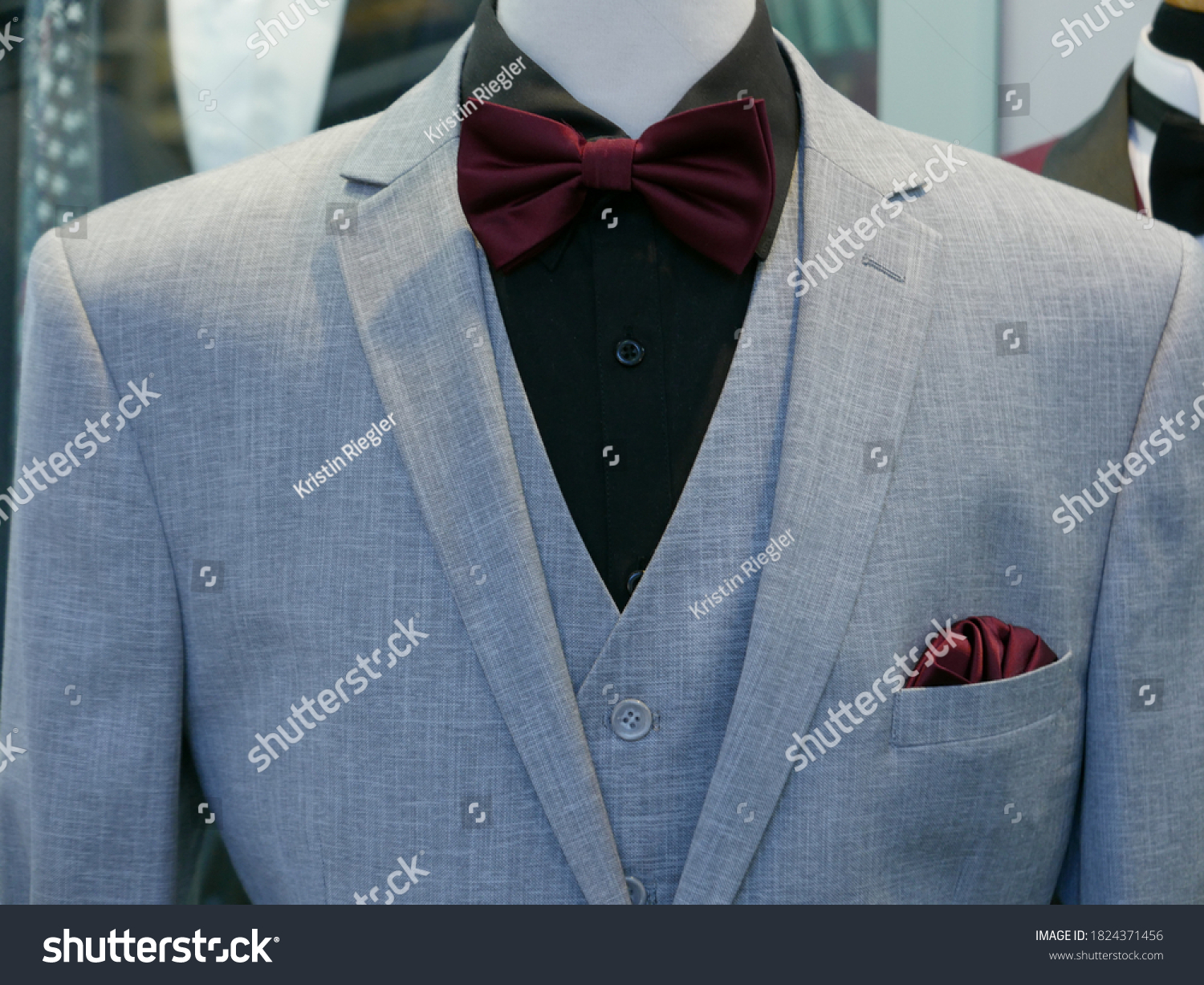 blue suit maroon bow tie