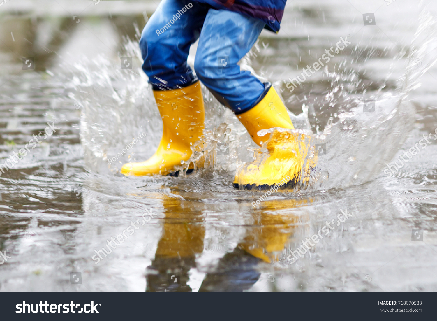 Closeup Kid Wearing Yellow Rain Boots 