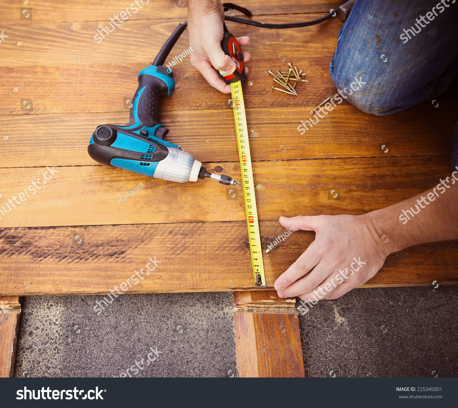 Close Male Hands Measuring Wood Flooring Stock Photo Royalty Free Close Up Of Male Hands Measuring Wood Flooring With Tape Measure
