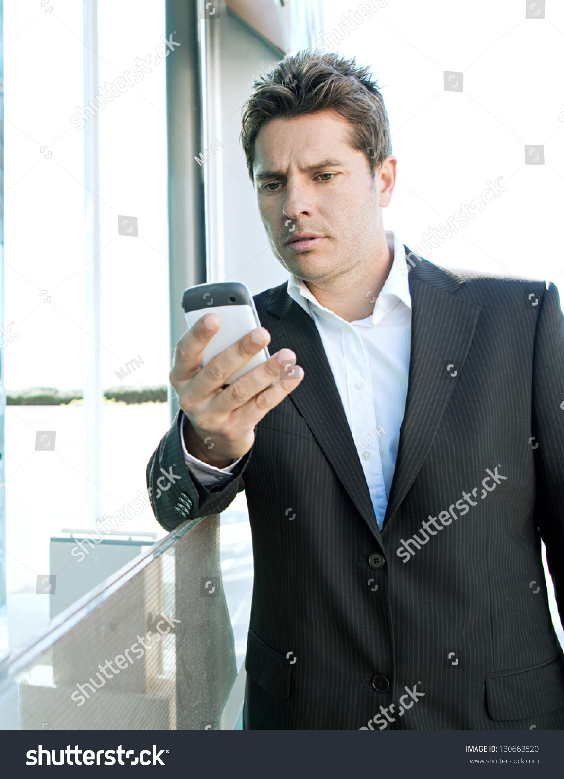 Close Up Portrait Of A Professional Business Man Holding A 