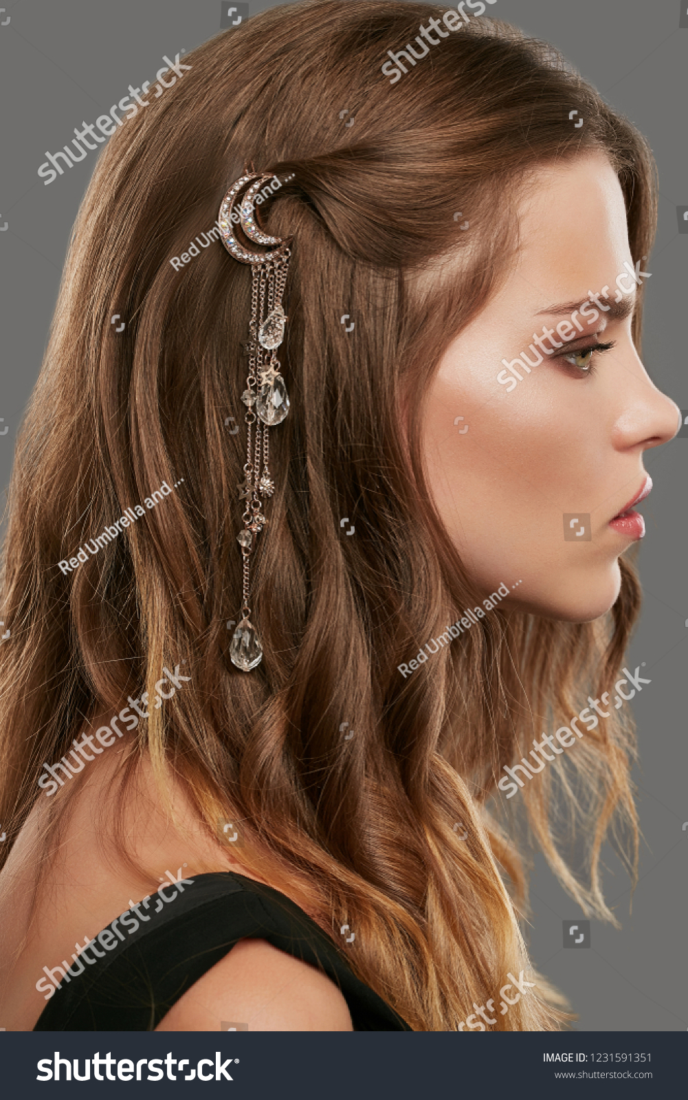 Close up portrait of a young lady with natural make,up and brown wavy hair