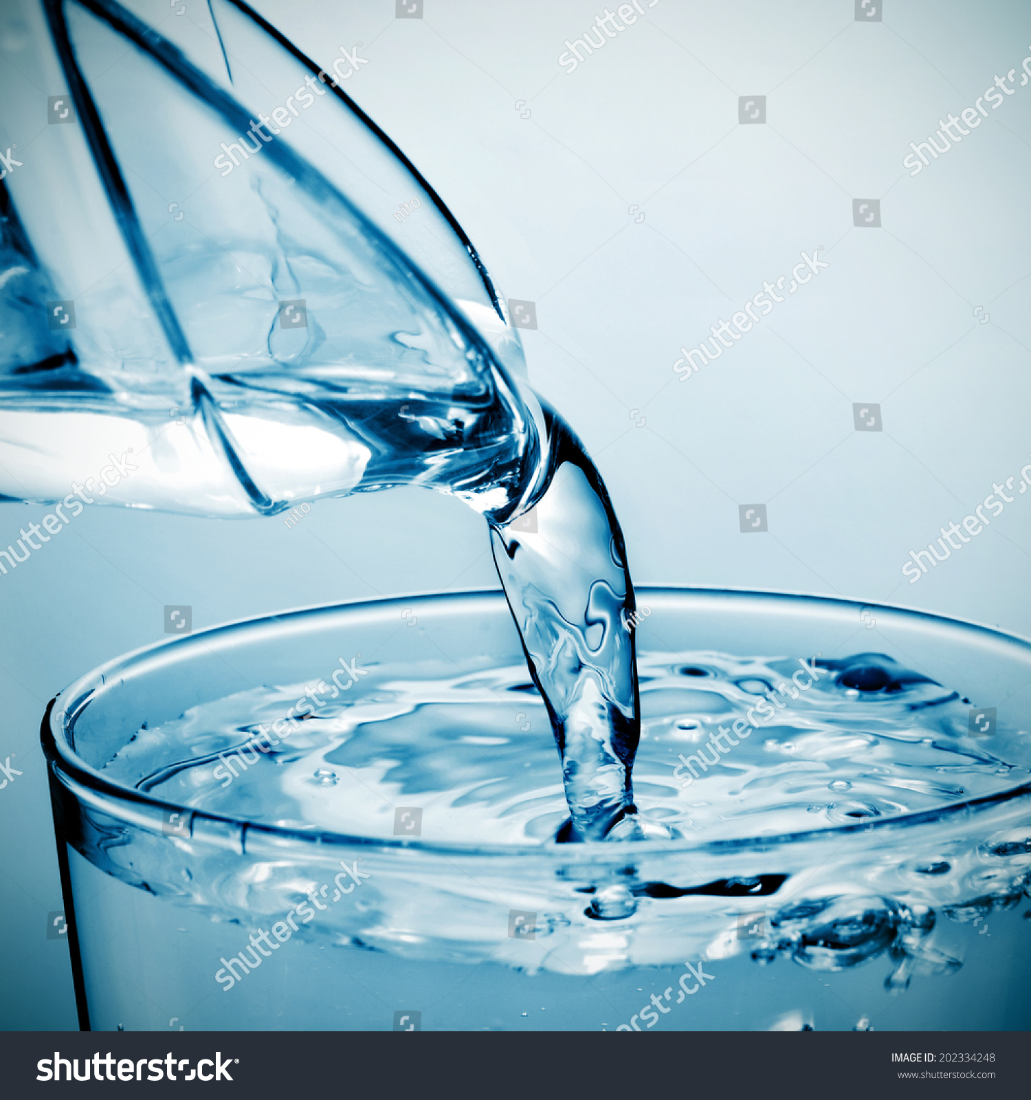 Closeup Of A Refreshing Glass Of Water Which Is Being Filled From A ...